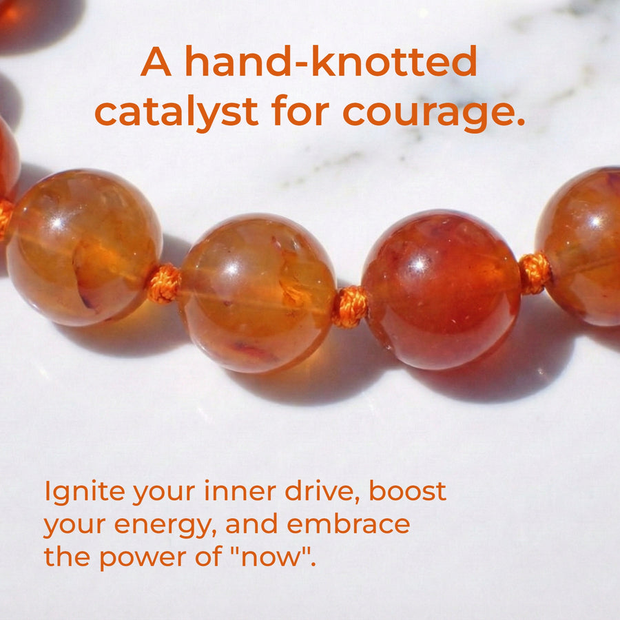 Hand-knotted 6mm natural fiery orange Carnelian gemstone bracelet with an adjustable minimalist closure.